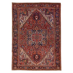 Ancien tapis persan Heriz rouge en laine fait à la main avec motif de médaillon