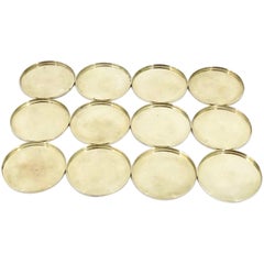 Set of Twelve Arne Jacobsen Brass Table Coasters Produced by Stelton