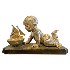 Early 20th Century Silvered Bronze Enfant Jouant Avec Un Bateau