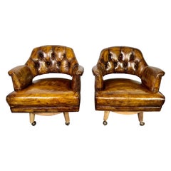 Pair of Mid-Century Leather Tufted Armchairs on Swivels
