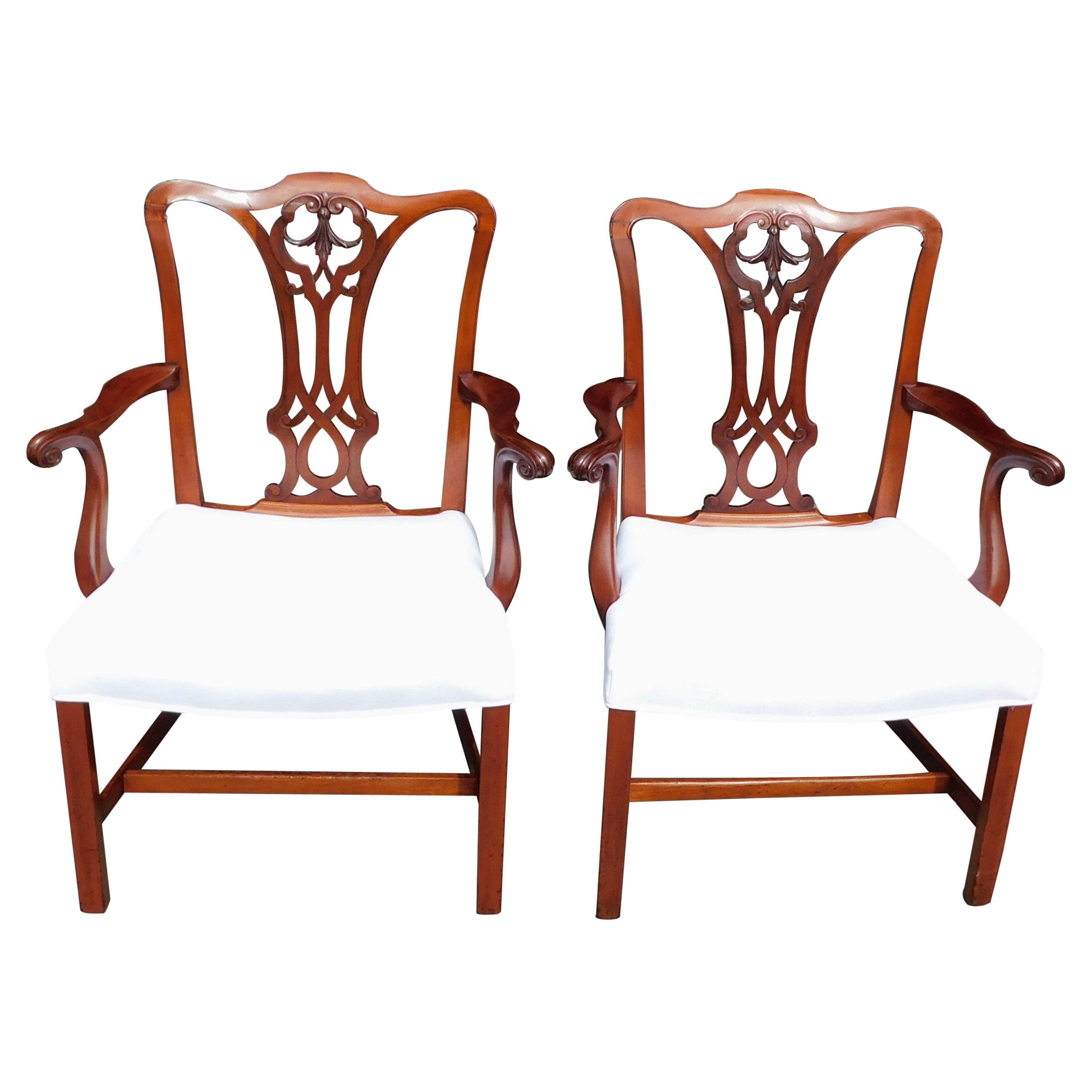 Pair of English Mahogany Serpentine Crest Arm Chairs with Saddle Seats, C. 1820 For Sale
