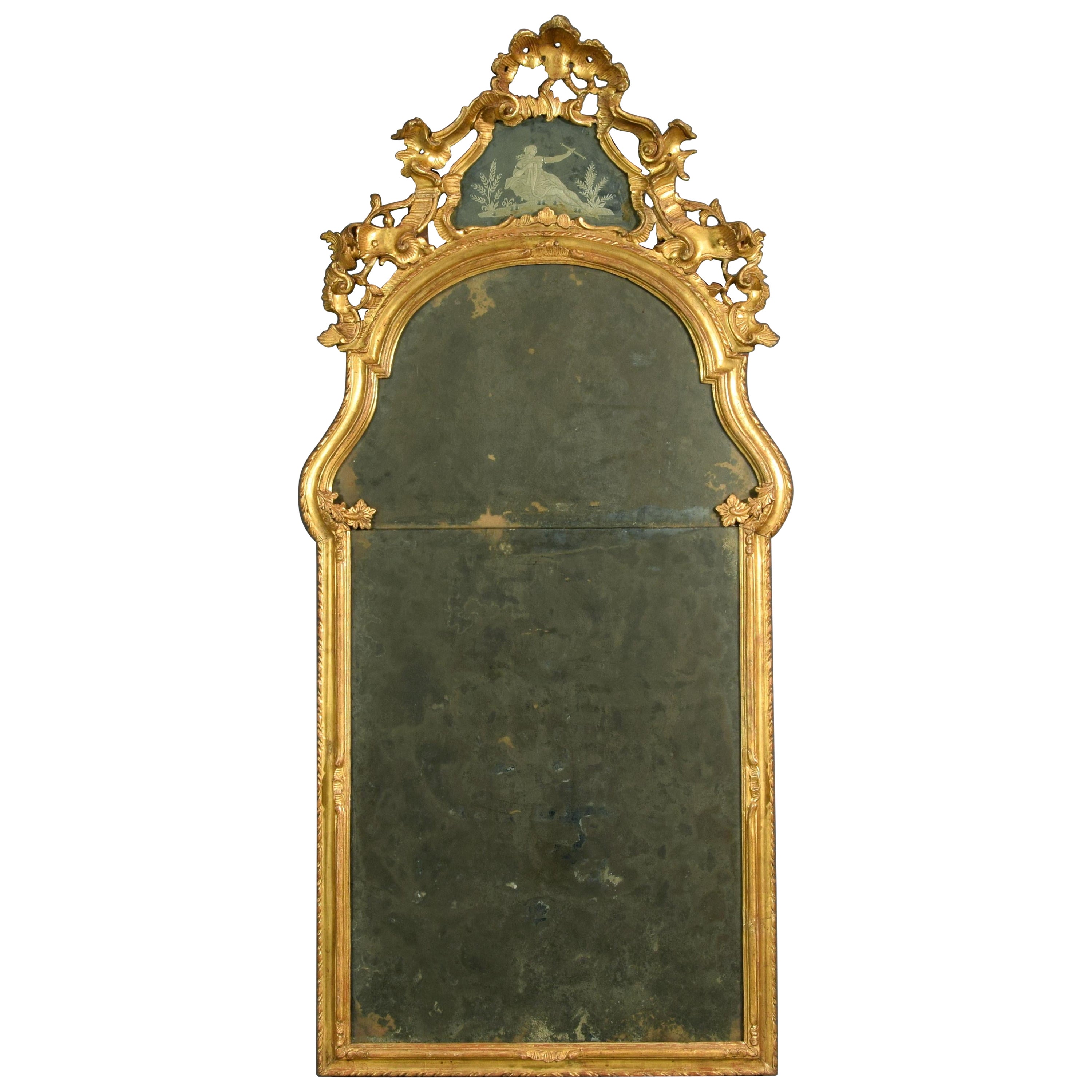 Miroir baroque italien du XVIIIe siècle en bois sculpté et doré en vente