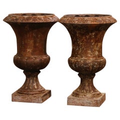 Pair of 19th Century French Weathered Iron Campana Form Garden Urns