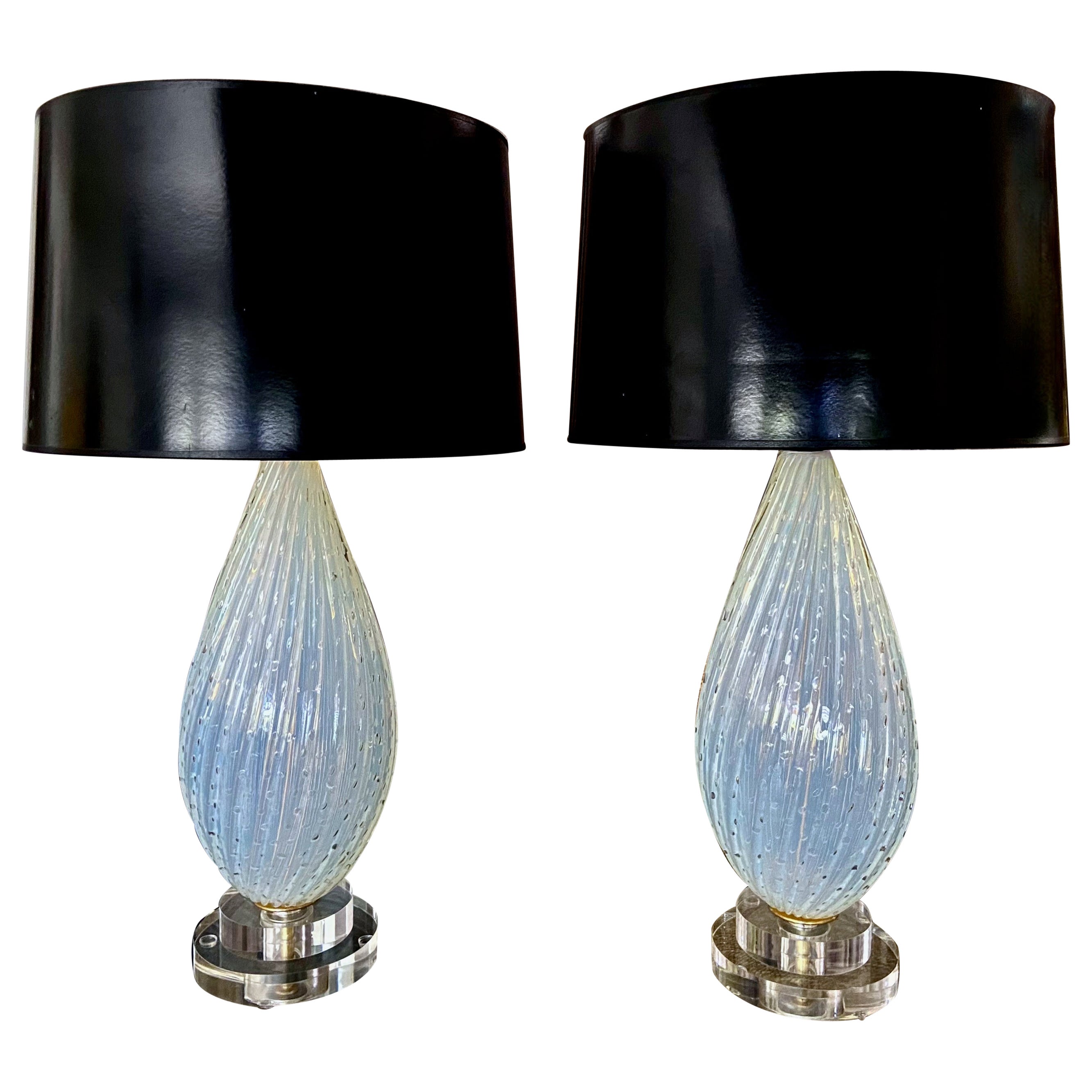 Pair of Murano Venetian hand blown ribbed opalescent glass table lamps with controlled bubbles. The color is opaque white with light shade of blue. New custom acrylic bases, rewired with new brass 3 way sockets and French style twisted rayon covered