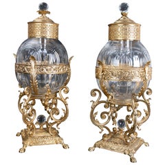 Pair of Bronze Jars Holding Lidded Glass Container