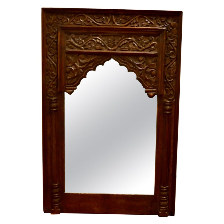 Miroir indien en teck sculpté En vente sur 1stDibs