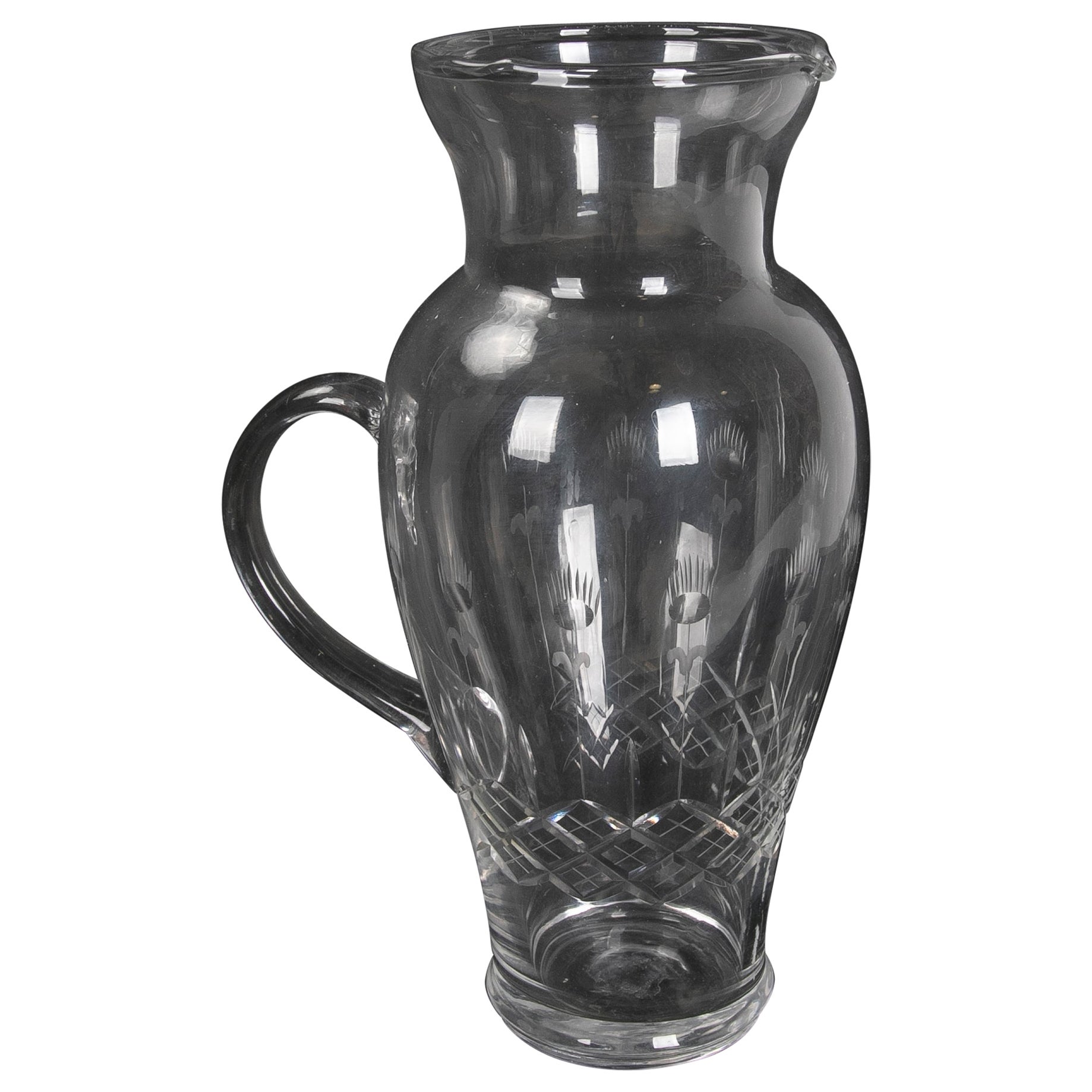 Hand Carved Glass Pitcher with Hand Carved Serving Handle For Sale