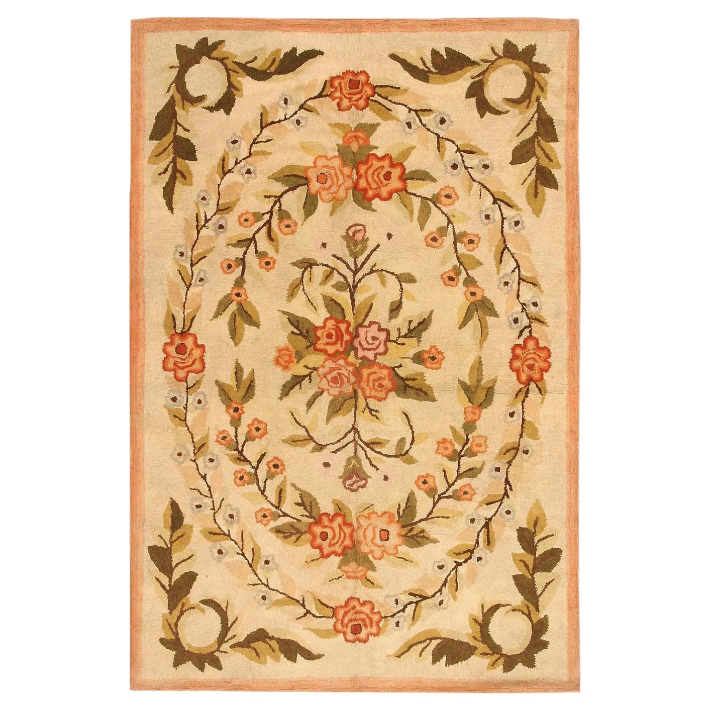 Antique Floral American Hooked Rug. Size: 5 ft 11 in x 8 ft 11 in For Sale