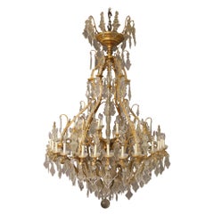 Impressionnant et palatial lustre à 48 lumières du 19ème siècle en bronze doré et cristal