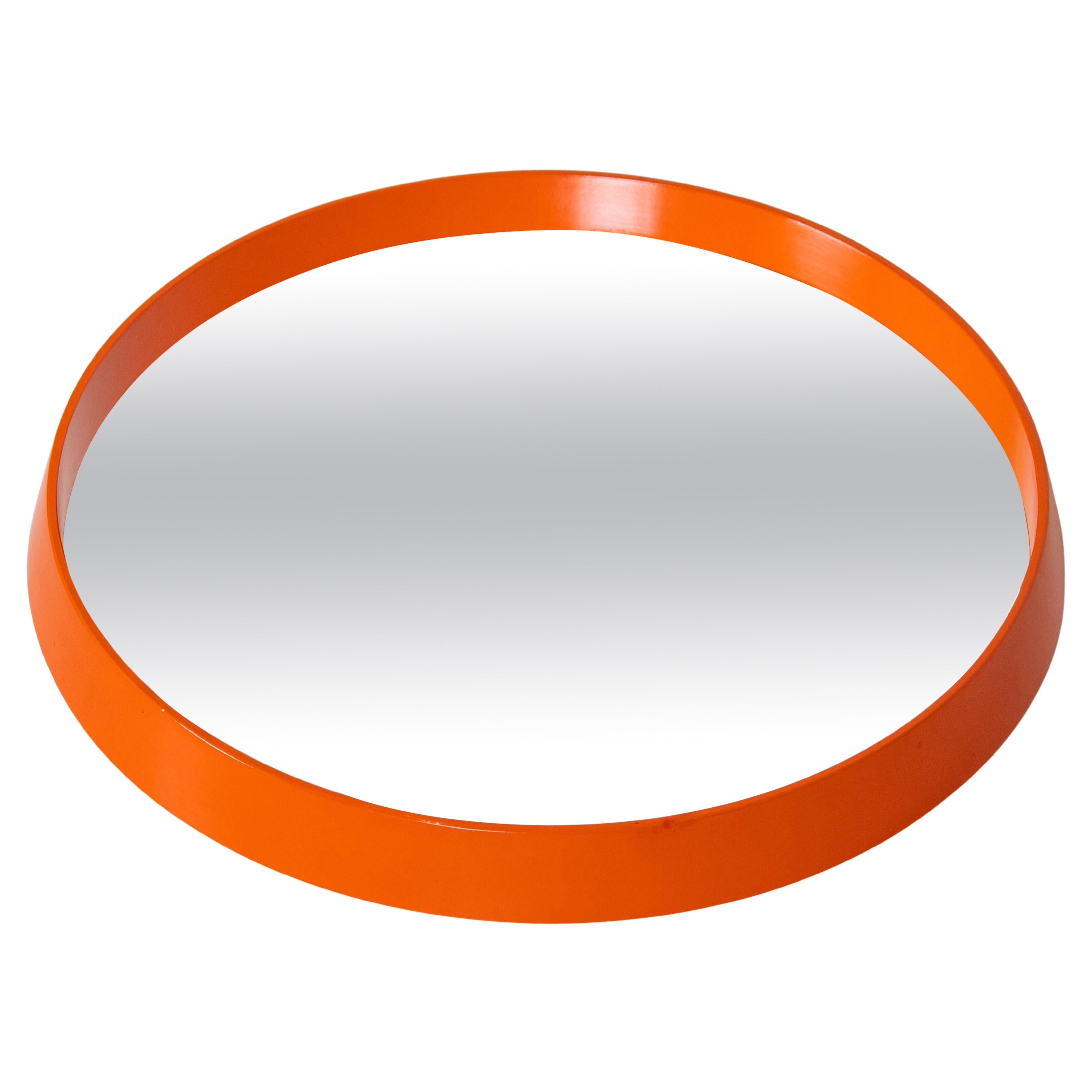 A 1960s vintage orange wall mirror with wood frame and original glass. Round shaped . Original painting. In very good conditions.