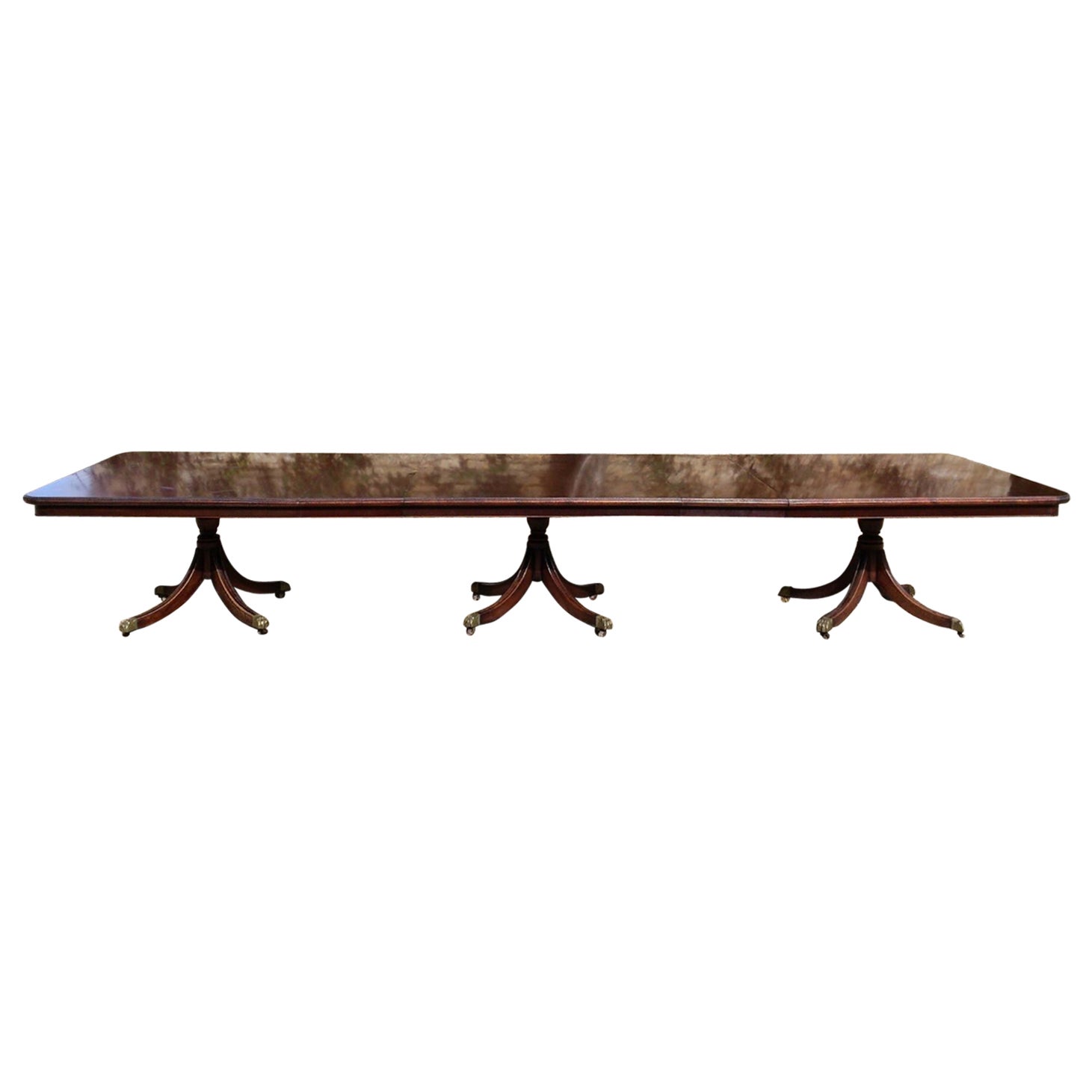 An English Style Triple Pedestal Banded Mahogany Dining Table