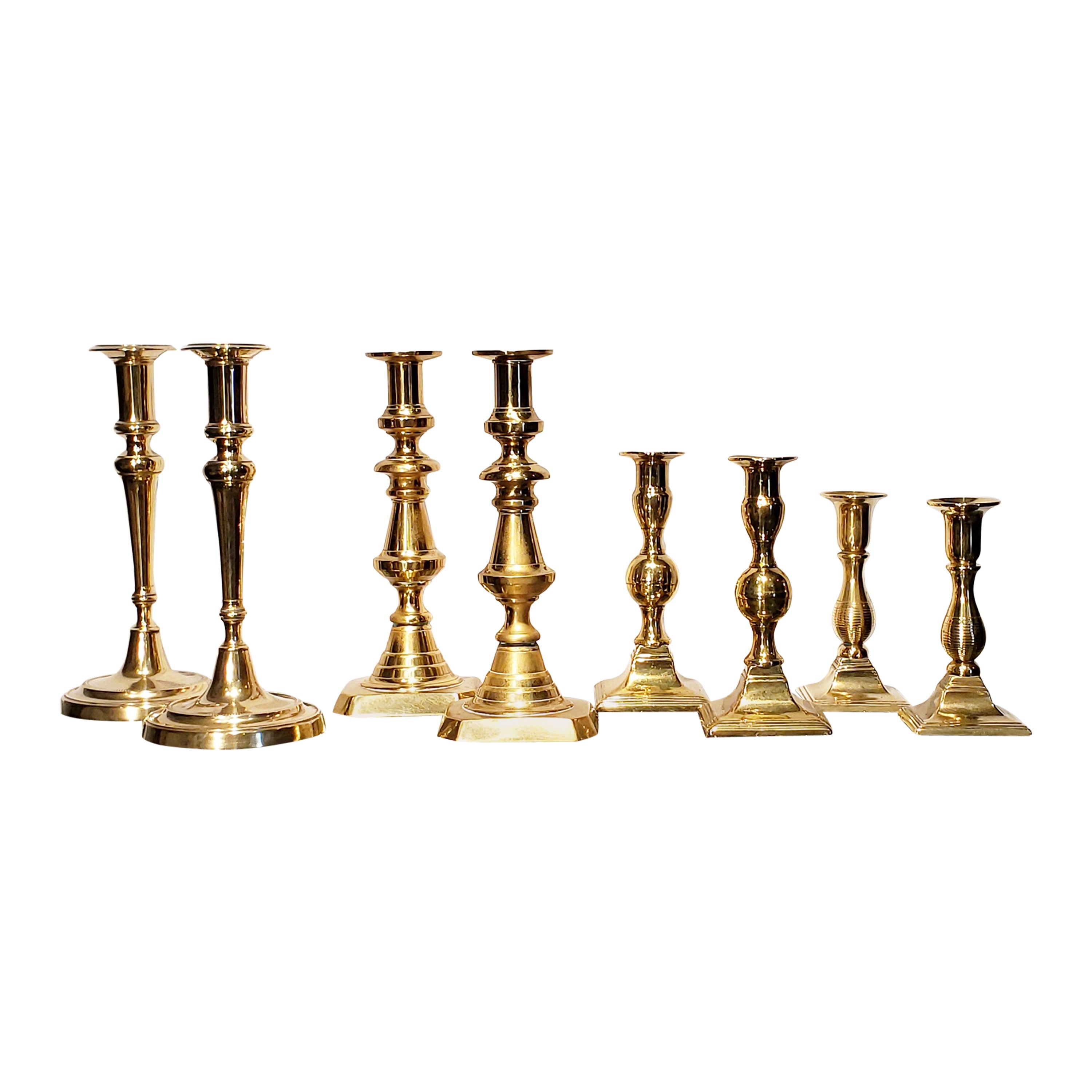 Four Pairs of 19th Century Brass Candlesticks