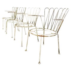 Set of four Midcentury rustic cast iron garden chairs in white. 