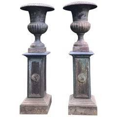 Pair of Tall Cast Iron Medici Urns on Pedestals with French Republic Medallions
