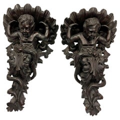 Pair of French Baroque Style Turn of Century Ornately Carved Putti Wall Sconces 
