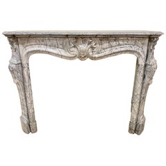 19th Century French Bleu Turquin Louis XV Carved Marble Mantel