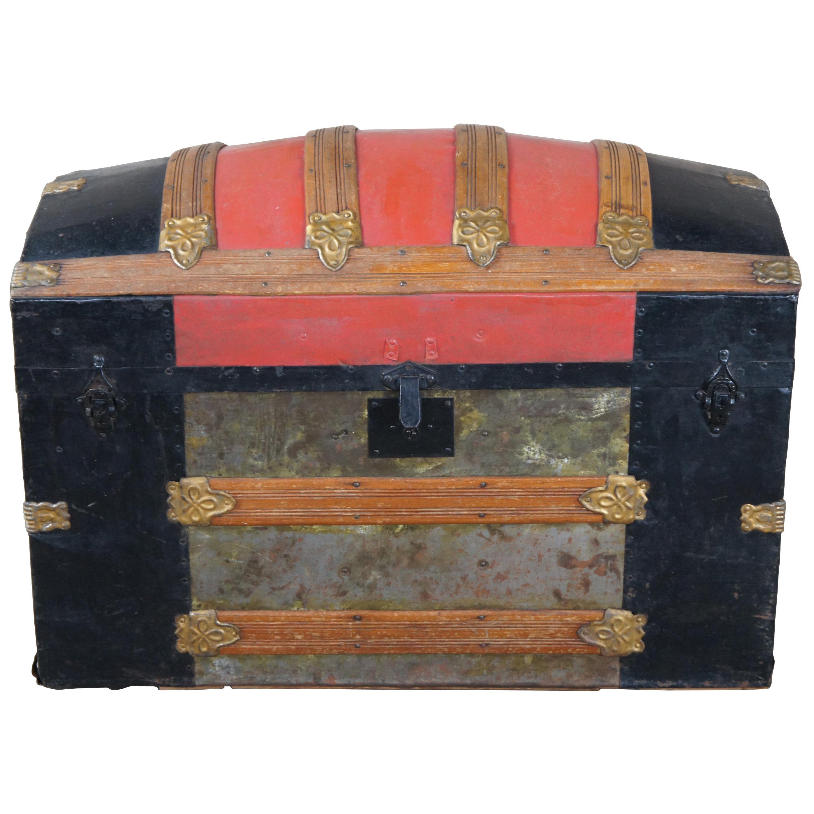 A rare original Victorian dome top or hump back steamer trunk. Includes original inserts with scenes. Made from metal with oak trim, embossed hardware and leather handles.
 