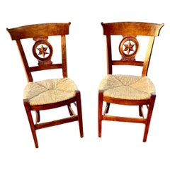 Pair of 19th Century French Provincial Carved Cherry Chairs with Rush Seats