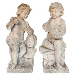 Paire de putti en pierre sculptée du 20ème siècle