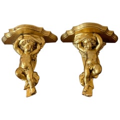 Vintage Gilt Hand Carved Putti Cherub Wall Bracket Shelves, a Pair