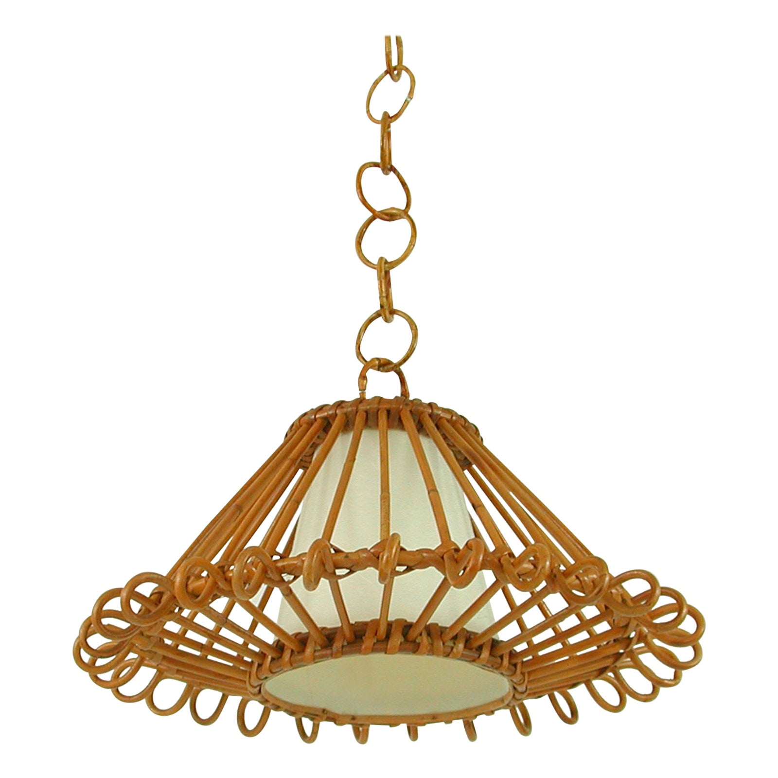 This beautiful handcrafted pendant was designed and manufactured in Spain in the 1960s. It features a large rattan lampshade, bamboo chain and off-white mulberry paper covered diffuser. 

The light has been rewired with new fabric cord for use in