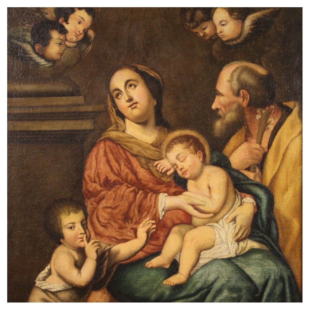Antique Italian painting from the 18th century. Artwork oil on canvas depicting religious subject Holy Family of good pictorial quality. Nice size painting of pleasant decor adorned with a modern wooden side frame fixed with nails on the side of the