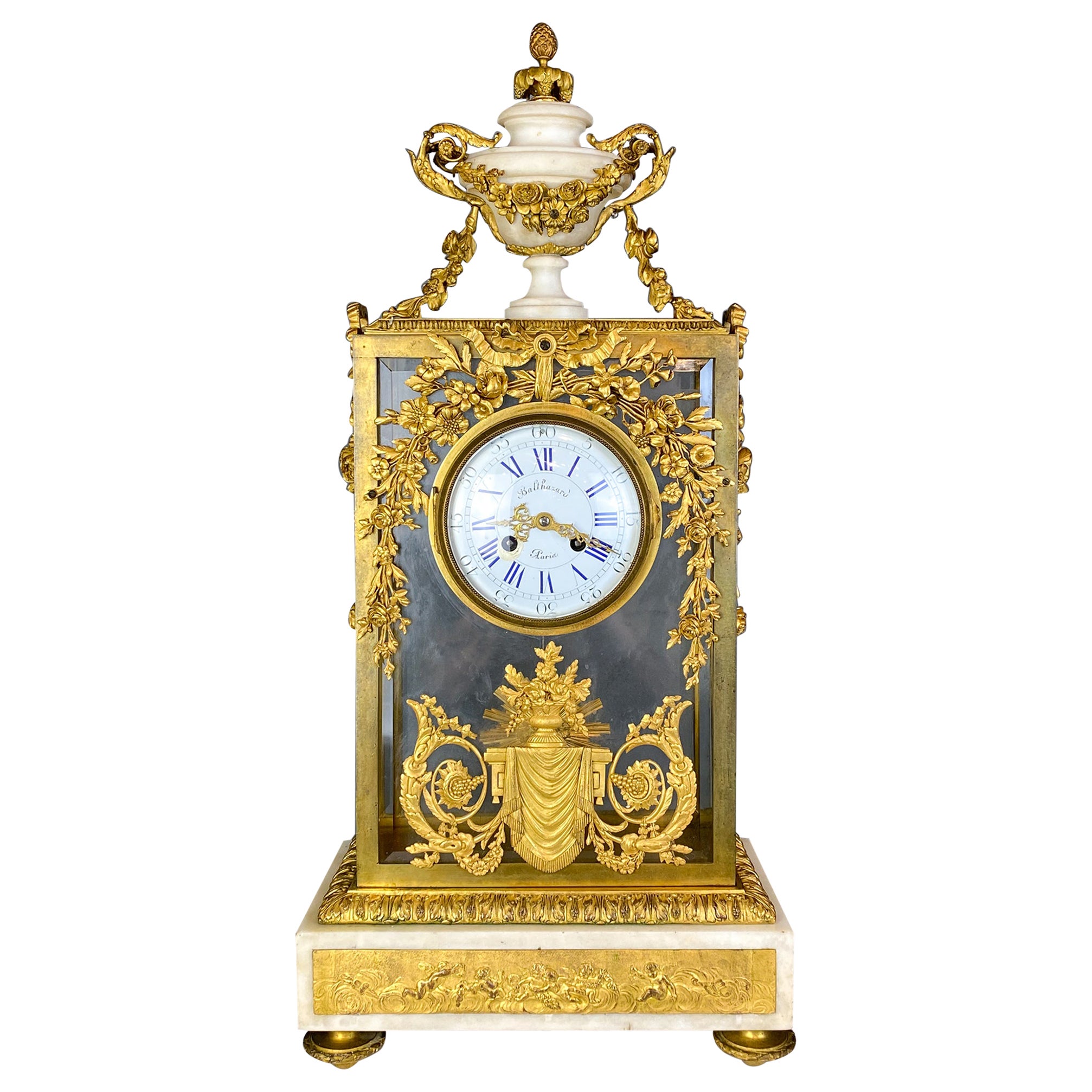 Fine Gilt Bronze and Glass Clock with Sun Pendulum, Floral and Urn Details For Sale