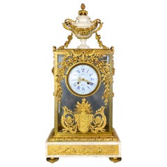 Fine Gilt Bronze and Glass Clock with Sun Pendulum, Floral and Urn Details