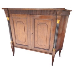 Regency Styled 2 Door Walnut Cabinet with Gilt and Ebonized Columns by Baker