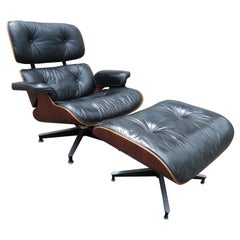 Charles Eames fauteuil de salon vintage en bois de rose 670 et ottomane 671 pour Herman Miller