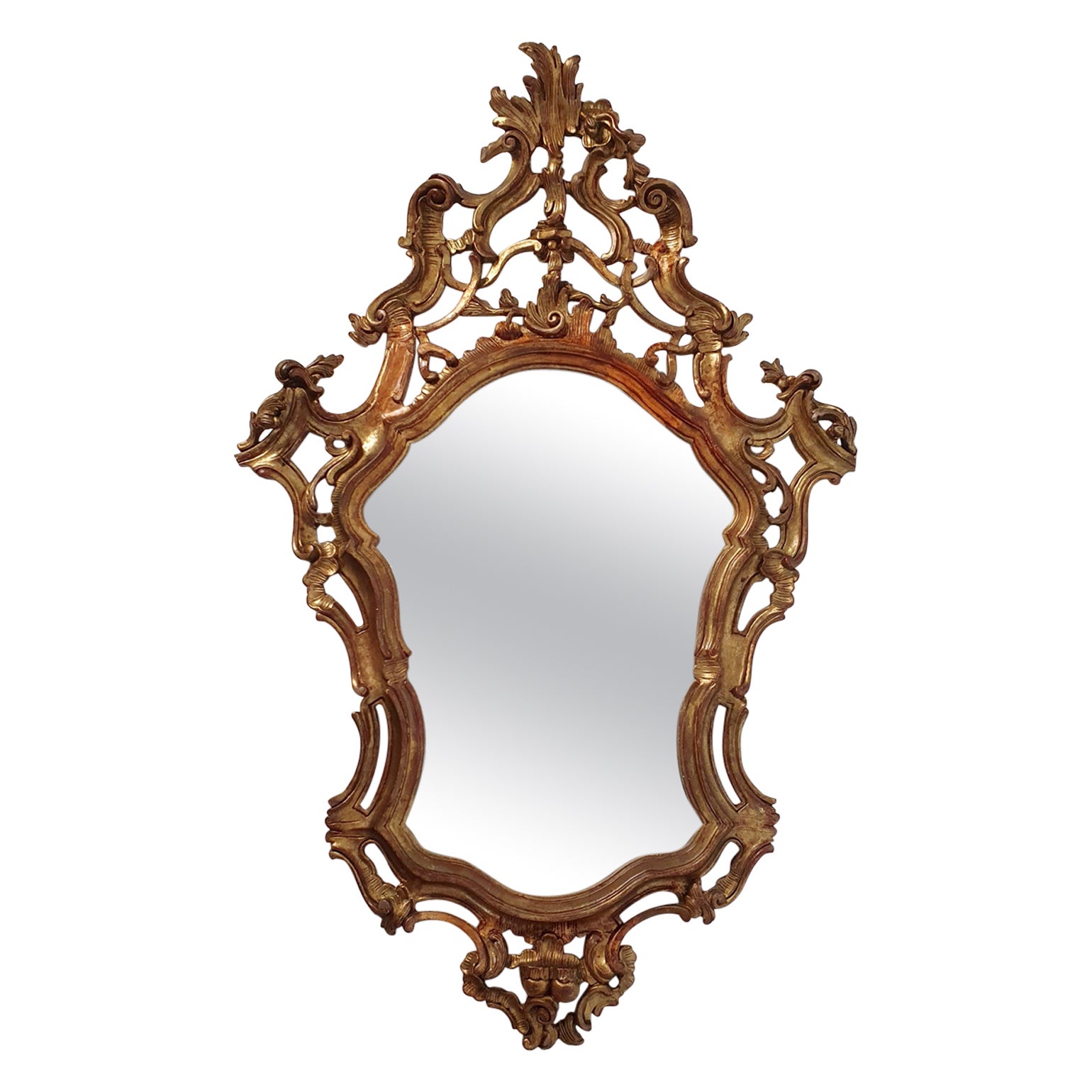 Miroir rococo italien sculpté et doré à la main