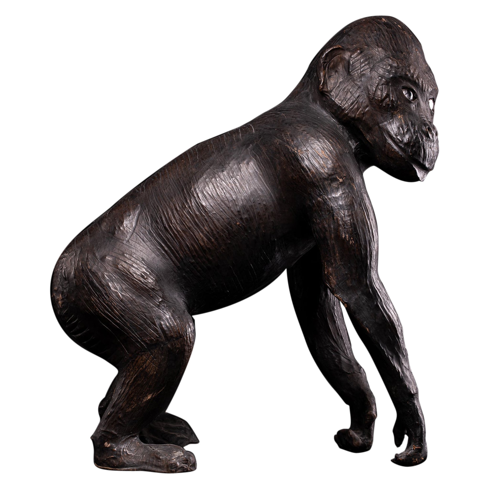 Leather Covered Walking Monkey Statue with Glass Eyes and Beautiful Age Patina For Sale