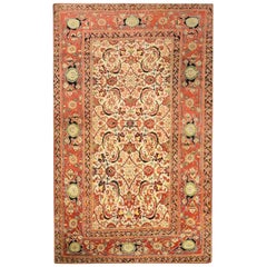 Tapis Agra du XIXe siècle, rouge et jaune sur fond beige.