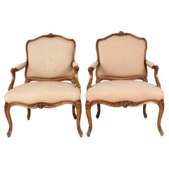 18th Century Pair of Louis XV Carved Walnut Armchairs, Stamped "Poussiée"