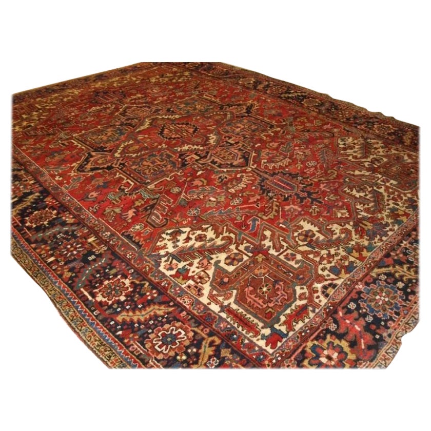 Antique Heriz Carpet with Large Medallion on Madder Red Field For Sale