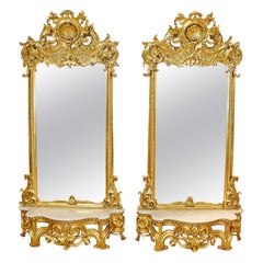Paire monumentale de miroirs-consoles de pilier dorés de style Louis XV, vers les années 1940