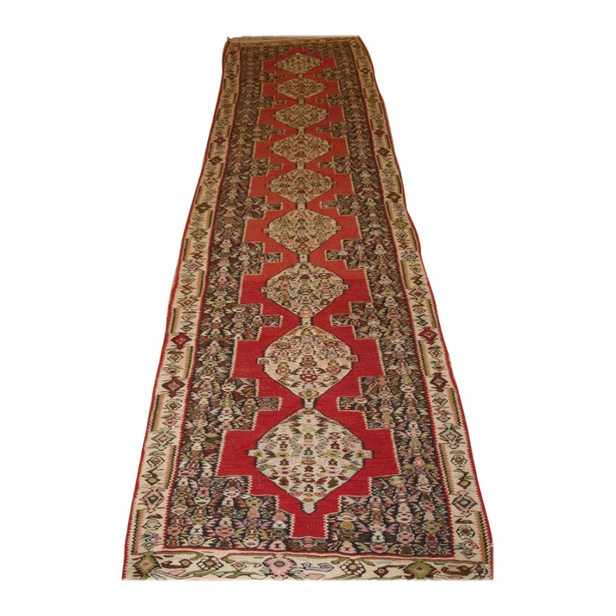 A Fine Senneh Kilim Runner with Soft Colours and a Linked Medallion Design For Sale