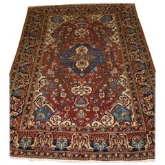 Antique Isfahan Rug with Small Medallion Design