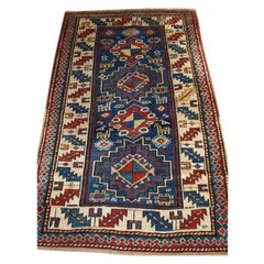 Antique Caucasian Kazak Rug with Bold Animal Design