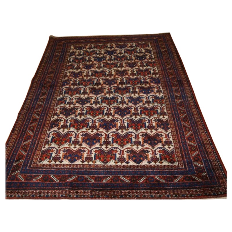 Old Afshar Rug of Repeat Shield Design on an Ivory Ground