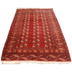 Tapis turkmène antique Tekke au design traditionnel