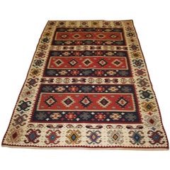 Antigua alfombra turca Sarkoy Kilim, borde marfil, diseño en bandas, hacia 1920