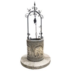 Geschnitzter Brunnenkopf aus Kalkstein im byzantinischen Stil mit verschnörkelten Eisenarbeiten