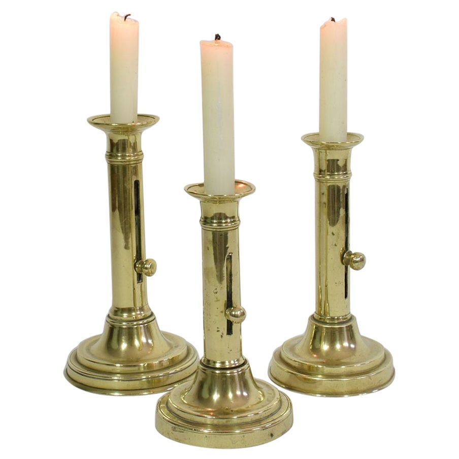 Collection of 3 French 19th Century Brass Bistro Push Up Candleholders For Sale