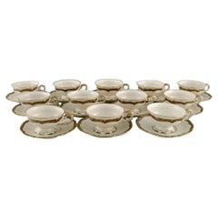 KPM, Berlin, Twelve Royal Ivory Tea Cups with Saucers in Cream-Colored Porcelain