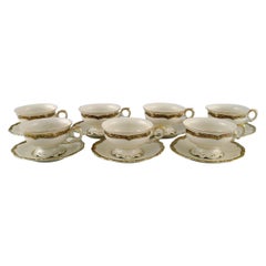 KPM, Berlin, Seven Royal Ivory Tea Cups with Saucers in Cream-Colored Porcelain 