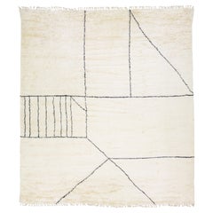 Alfombra moderna de estilo marroquí hecha a mano en lana marfil con diseño geométrico by Apadana