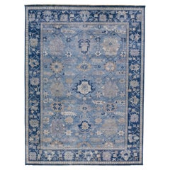 Tapis en laine bleu de la collection artisanale Apadana fait à la main à motifs floraux