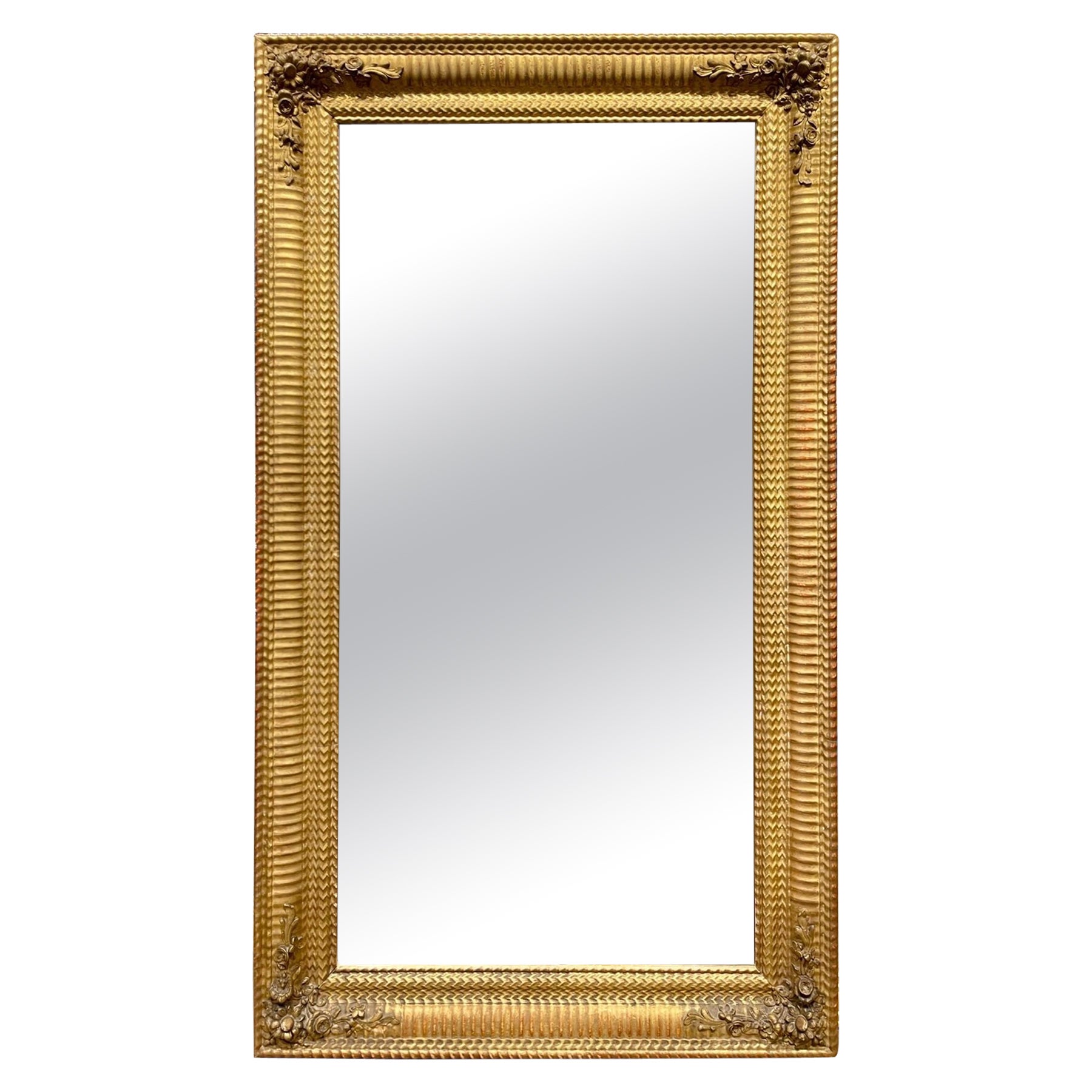 19th Century French Transitional Giltwood Reeded Mirror with Flowers