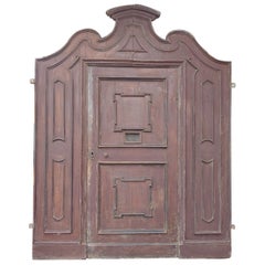 Antique double-sided entrance door in carved walnut, 18th century Italy